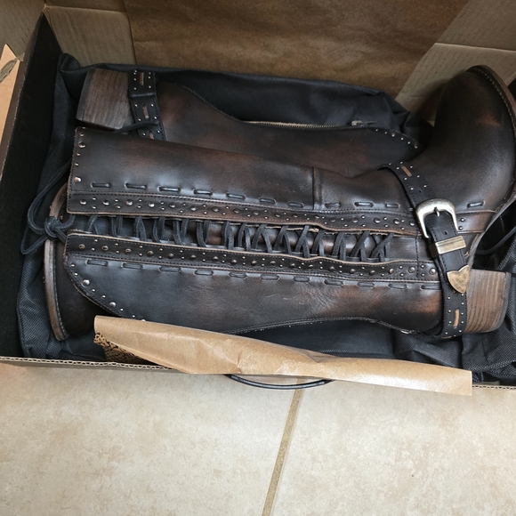 Freebird distressed black Contour boots. Side lacing with buckle accent
